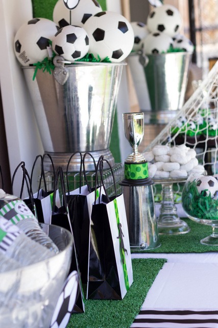 Soccer ball centerpieces in a fabulous silver bucket to look like a trophy!