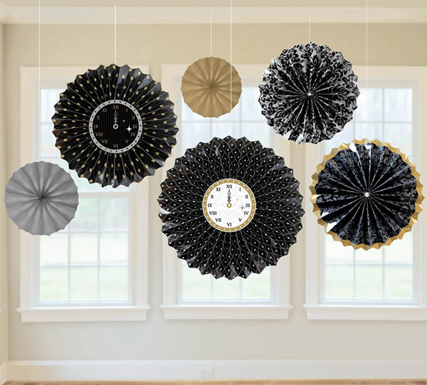 Hanging paper fans with clocks for New years eve!