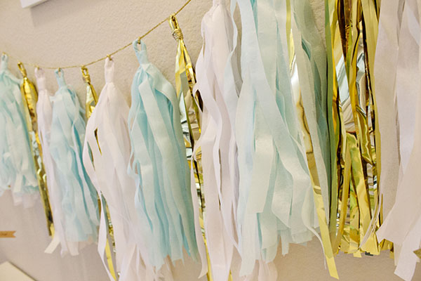 Mint, Gold And white tassle garland is so lovely! -B. Lovely Events