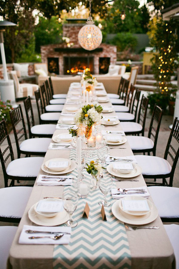 Gorgeous chevron runner at this outdoor dinner party
