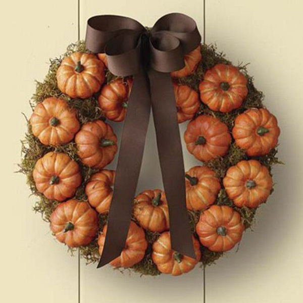 Love this fall wreath overflowing with pumpkins!