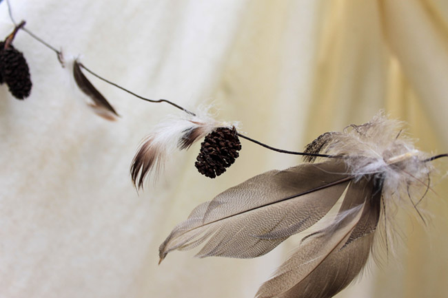 Easy DIY Feather and Pinecone Garland - See More Lovely Kid's Camp Out Ideas on B. Lovely Events