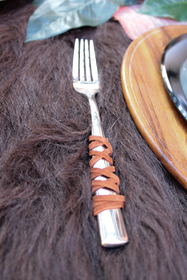 Leather Wrapped Silverware For A Rustic Outdoors Tablescape- See More Woodsy Tablescape Details On B. Lovely Events