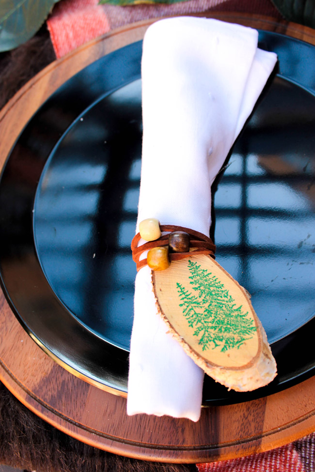 Love These Leather Wrapped Napkins- Perfect for an Outdoor Themed Tablescape- See More Woodsy Tablescape Details On B. Lovely Events