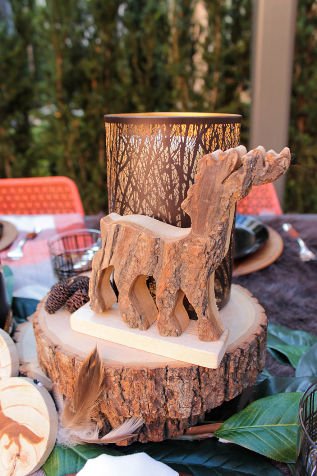 Love this adorable wooden deer on this ourdoor natural tablescape! - See More Woodsy Tablescape Details On B. Lovely Events