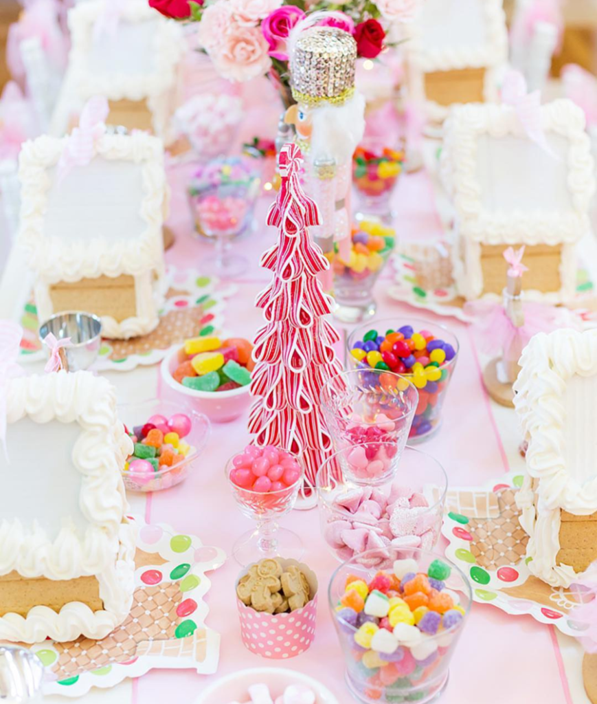 Love all of the pink details of the darling GIngerbread house party! - See more pink Christmas ideas on B. Lovely Events! #christmas #christmasparty #christmasideas #christmasdecor