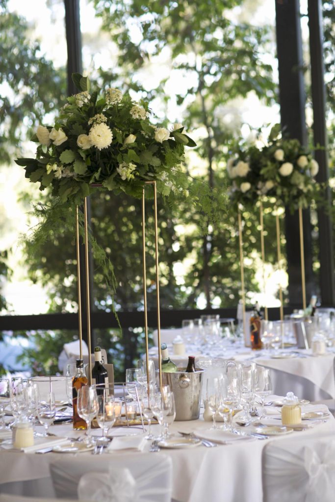 fabulous tall wedding centerpieces with white flowers and leafs - See all the beautiful details on B. Lovely Events! #wedding #realwedding #weddingideas #weddingtips #weddingdecorations