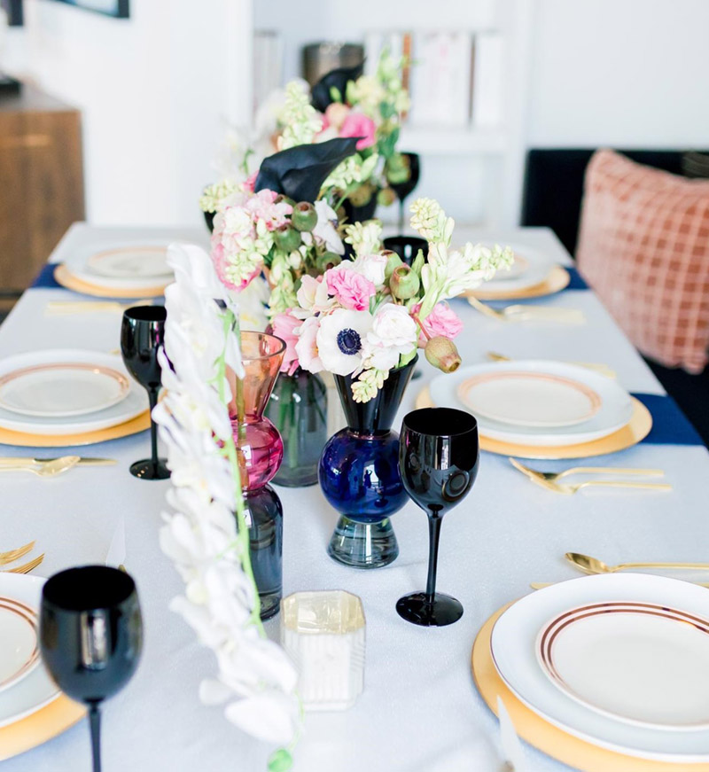 Love this valentines day dinner tablescape- See all of the details on B. Lovely Events! #valentinesday #tablescape #orchids #anenomies #centerpiece 