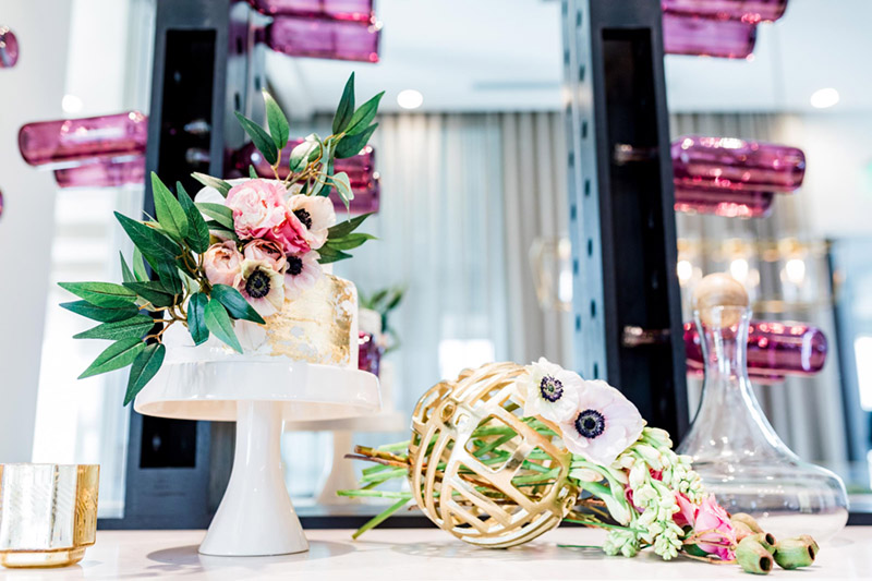 This cake is out of this world amazing! - See all of the details on B. Lovely Events! #valentinesday #tablescape #orchids #anenomies #centerpiece  #goldcake #decoratedcake